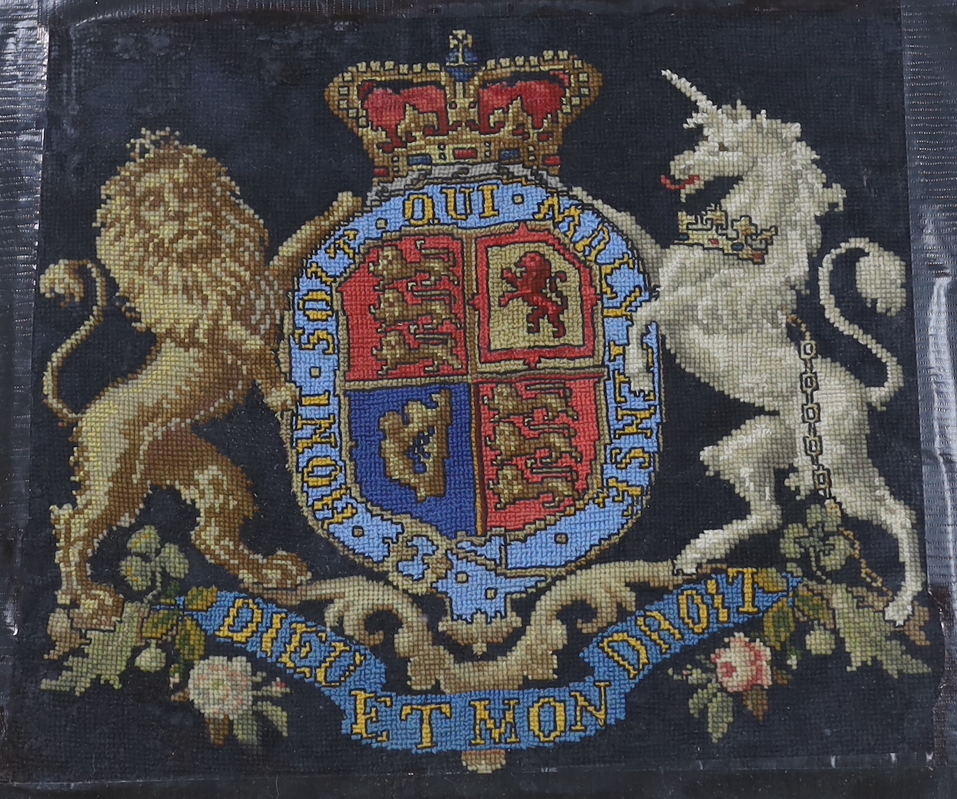 A Victorian wool worked panel of The Royal Coat Of Arms, 34cm wide x 30cm high